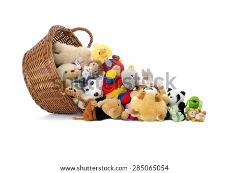 Stuffed animal toys in a basket, isolated on a white background 