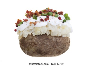 A Stuffed Baked Potato With Sour Cream, Bacon Bits, And Green Onions. Shot On A White Background. 