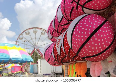 Stuffed Basketball Toys At Rural Carnival, Shallow DOF Focus On First Ball