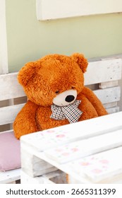 Stuffed Bear at a Table