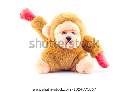 Stuffed brown monkey doll isolated on white background.