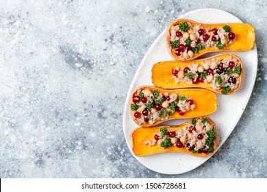 Stuffed Butternut Squash With Chickpeas, Cranberries, Quinoa Cooked In Nutmeg, Cloves, Cinnamon. Thanksgiving Dinner Recipe. Vegan Healthy Seasonal Fall Or Autumn Food