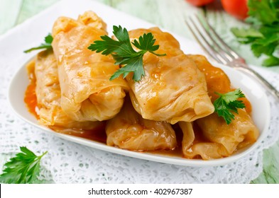 Stuffed cabbage rolls with rice and meat in tomato sauce