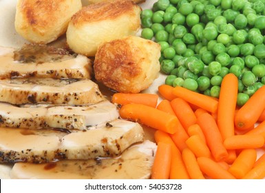 Stuffed Chicken Breast With Roast Potatoes, Vegetables And Gravy.