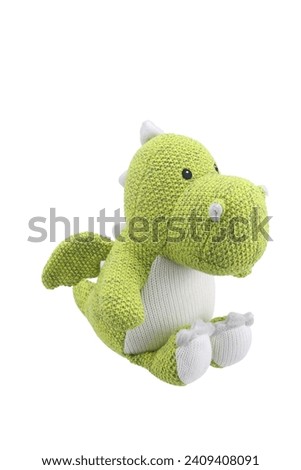 stuffed dinosaur doll plaything for kids isolated on white background. child soft toys collection. top view character puppet. green and white dinosaur.