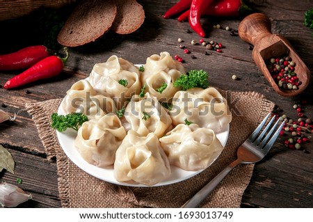 Stuffed dumplings, manti of dough and minced, close up