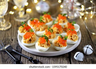 Stuffed Eggs With Salmon Caviar. Christmas Background.