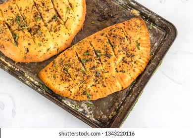 Stuffed Garlic Bread On A Baking Sheet, Top View, Directly From Above