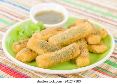 Stuffed Jalapenos - Green Chilies Filled With Cheese, Breaded And Deep Fried. Served With Jalapeno Relish.