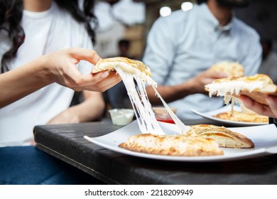 Stuffed Naan Cheese Pull Girl Hand Eating Outdoor At Karachi's Food Street. 