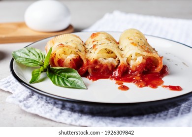 Stuffed pasta with seafood and cheese in tomato sauce.