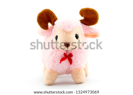 Stuffed pink sheep doll isolated on white background.