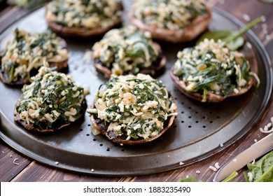 
Stuffed portobello mushrooms. Mushrooms stuffed with spinach, onion, and garlic, with mozzarella cheese. Delicious and healthy snack.
