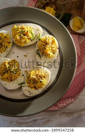 Stuffed Russian deviled eggs topped with everything bagel seasoning