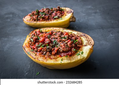 Stuffed Spaghetti Squash With Ground Beef Tomatoes And Seasoning. Topped With Parsley