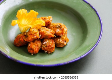 Stuffed Squash Blossoms On A Green Tin Plate