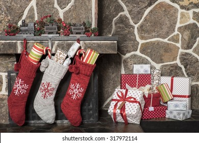 Stuffed Stockings Hanging On A Fireplace On Christmas Morning
