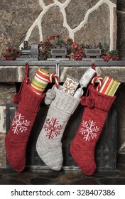 Stuffed Stockings Hanging On A Fireplace On Christmas Morning