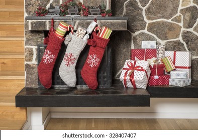 Stuffed Stockings Hanging On A Fireplace On Christmas Morning 