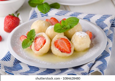Stuffed strawberry dumplings, delish dessert with herbs, food photography