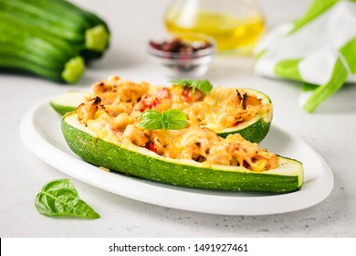 Stuffed zucchini boats. Selective focus, space for text.