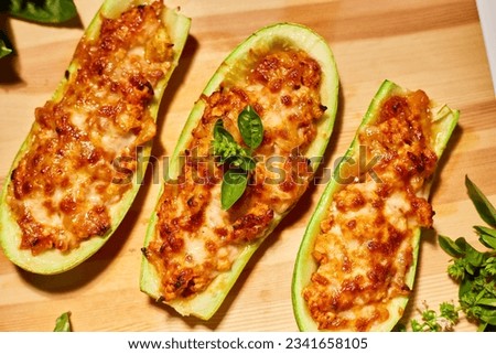 Stuffed zucchini on white background, baked loaded zucchini boats, Top view, Homemade.