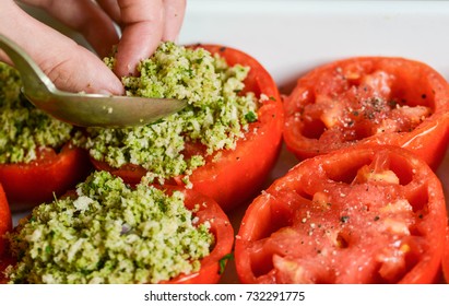 Stuffing tomatoes with bread crumbs and herbs - Powered by Shutterstock