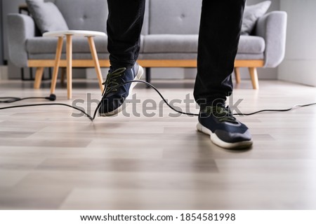 Stumble Over Cable. Clumsy Office Falldown. Insurance Compensation