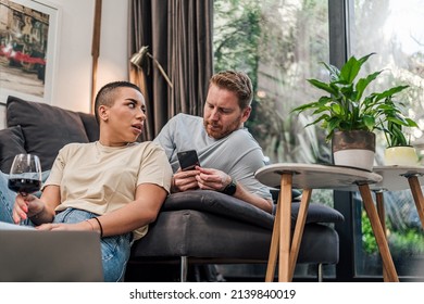 Stunned short haired woman, listening to her worried husband.