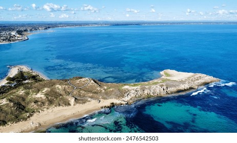 Stunning 4K aerial drone photo of Penguin Island, Perth, Australia. Captures pristine beaches, turquoise waters, and lush greenery. Perfect for travel brochures, nature documentaries, and promotions. - Powered by Shutterstock