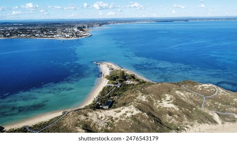 Stunning 4K aerial drone shot of Penguin Island with Rockingham, Australia in the background. Highlights pristine beaches, turquoise waters, and urban scenery. Perfect for travel and tourism projects. - Powered by Shutterstock