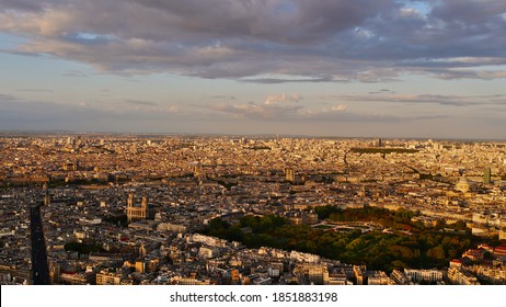 Stunning aerial panorama view over western city center of Paris, France with famous Jardin du Luxembourg and Luxembourg Palace, church Saint-Sulpice and Notre Dame cathedral in beautiful evening sun.