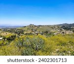 stunning aerial shot of the lush green majestic mountains ranges around Lake Mathews in the Cajalco Canyon in the foothills in Riverside California USA	