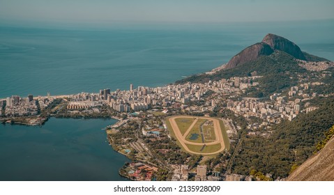 Stunning aerial sunset panorama of Rio de Janeiro, Brazil with Leblon neighborhood and Formula One track seen from Christ the Redeemer