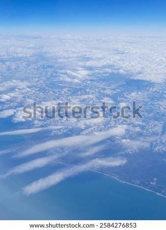Similar – Image, Stock Photo Snowy mountains near sea in winter day under sky