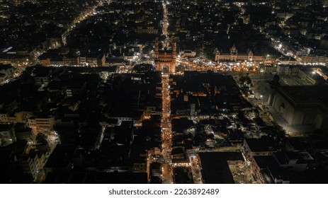 Stunning aerial view or drone shot of Charminar, Hyderabad at night. The vibrant city lights illuminate the bustling market below. Perfect for travel and cityscape themes. - Powered by Shutterstock