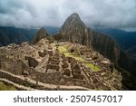 Stunning aerial view of Machu Picchu, the ancient Incan citadel nestled high in the Andes Mountains of Peru, bathed in early morning light, showcasing its majestic beauty and historical significance.