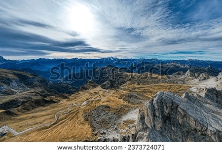 A stunning aerial view of the majestic mountain range and vast blue sky