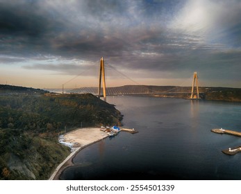 Stunning Aerial View of a Modern Suspension Bridge over a Coastal Estuary Yavuz Sultan Selim Bridge An aerial shot showcasing a breathtaking modern suspension bridge spanning a tranquil estuary.Beykoz - Powered by Shutterstock