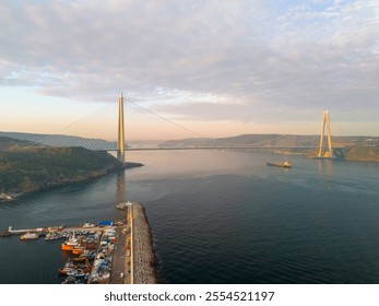 Stunning Aerial View of a Modern Suspension Bridge Spanning a Coastal Area Yavuz Sultan Selim Bridge. An aerial shot showcasing a magnificent suspension bridge, likely Beykoz Poyrazkoy Istanbul Turkey - Powered by Shutterstock