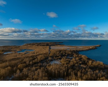 Stunning aerial view of Paljassaare Peninsula in Tallinn, Estonia. Vast coastal landscapes, serene wetlands, and the Baltic Sea meet under a vibrant blue sky. Perfect for nature and travel concept - Powered by Shutterstock