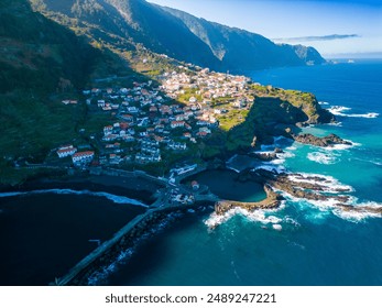 A stunning aerial view of a picturesque coastal town on a cliffside. Seixal, Madeira, Portugal - Powered by Shutterstock