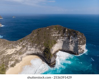 Stunning aerial view of a secluded beach with clear blue waters and dramatic cliffs. - Powered by Shutterstock