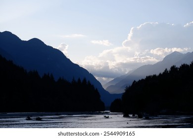 Stunning Aerial View of Squamish Valley at Dusk with Serene River, Sandy Beach, and Majestic Mountain Range Under a Twilight Sky – Squamish, British Columbia, Canada - Powered by Shutterstock