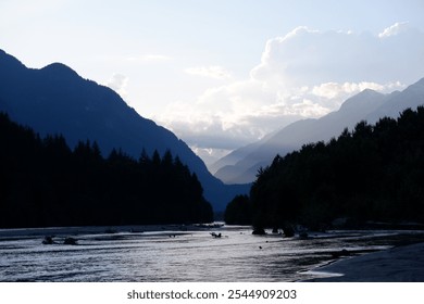 Stunning Aerial View of Squamish Valley at Dusk with Serene River, Sandy Beach, and Majestic Mountain Range Under a Twilight Sky – Squamish, British Columbia, Canada - Powered by Shutterstock