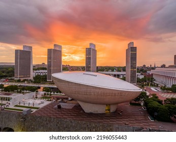 Stunning after the rain colorful sunset over The Egg performing art center and New York State government buildings in Albany with bright orange, red, purple sky - Shutterstock ID 2196055443