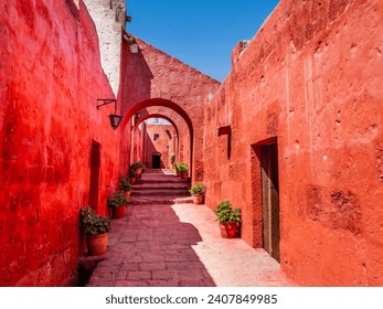 Stunning architectures of the ancient Santa Catalina monastery with bright red walls, Arequipa, Peru