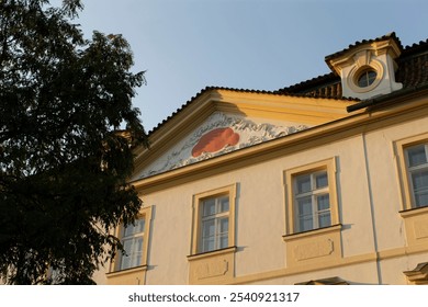 A stunning, beautiful historical building decorated with intricate frescoes and surrounded by lush greenery - Powered by Shutterstock