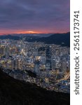 Stunning Busan Cityscape at Dusk with Vibrant Sunset Sky and Urban Lights