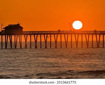 Stunning California sunset with vibrant skies, silhouetted palm trees, and serene beach vibes. This captivating image captures the essence of a tropical paradise, perfect for travel, nature, and lands - Powered by Shutterstock